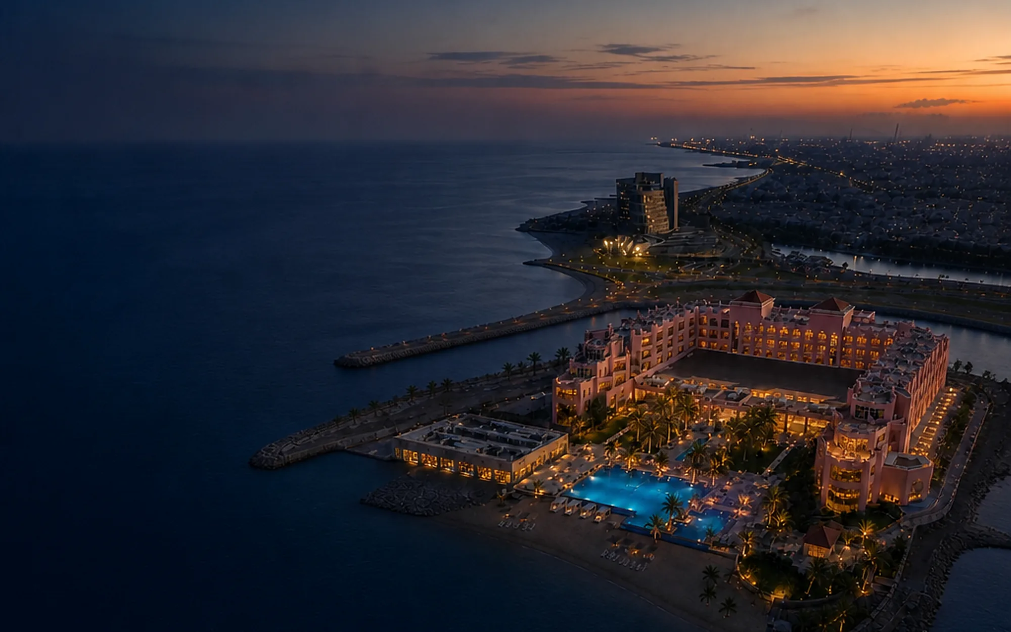 The Sariya headland after dark, lit against the Red Sea